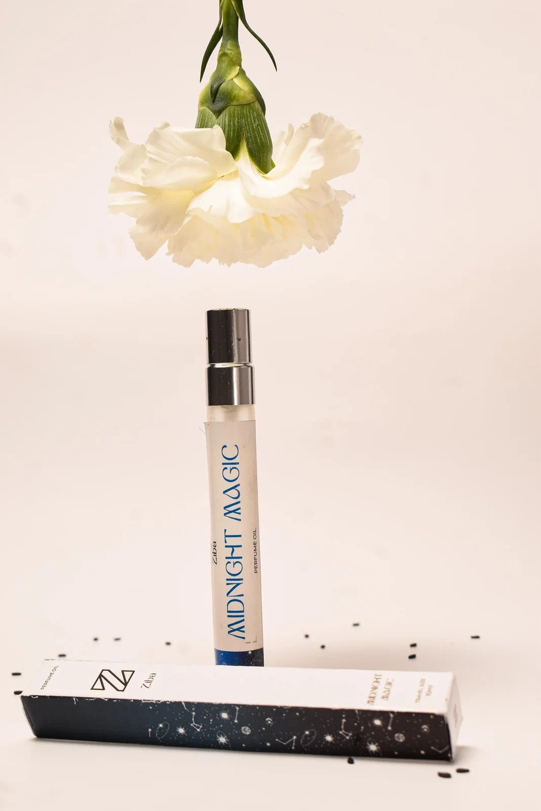 Midnight Magic fragrance with a white flower